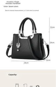 Detail of black pebbled leather tote bag with silver petal charm and size dimensions