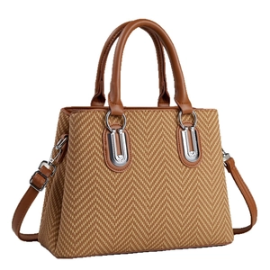 Brown woven tote bag with leather handles and silver U-shaped buckle in a 45-degree view