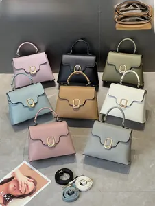 Litchi texture leather handbag with gold oval twist lock and dual compartment detail