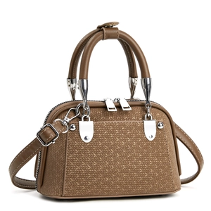 Brown woven texture leather handbag with silver hardware and adjustable shoulder strap