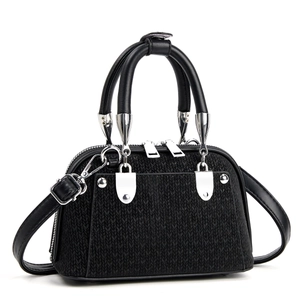 Chic black woven handbag with silver hardware and detachable crossbody strap