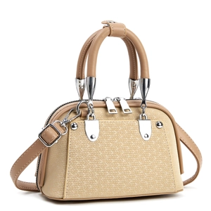 Detail of beige faux leather handbag with woven pattern and silver-toned dual zippers