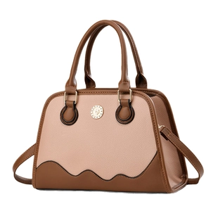 Boston style two-tone leather handbag with round gold buckle and crossbody strap