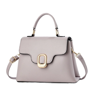 Elegant lavender lychee leather handbag for women with gold oval clasp and top handle