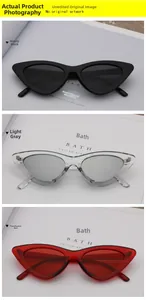 Trois variations de lunettes de soleil œil de chat en noir, gris et rouge poli