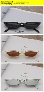 Three pairs of vintage cat-eye sunglasses in black, amber, and grey plastic frames