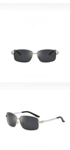 Detail of silvery black polarized pilot sunglasses with high-quality metal frame and gray lenses