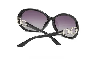Detail of polarized sunglasses showing silver chain temples with rhinestone accents