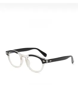 Detail view of round glasses frame featuring a classic black and transparent two-tone design