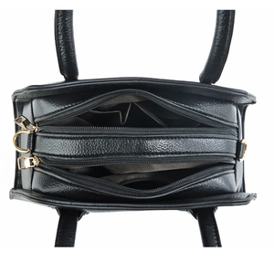 Top view of black tote bag showing three zipper compartments and dark lining