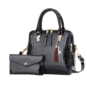 Black faux crocodile leather handbag set with matching long wallet and red tassel charm