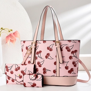 Dreiteiliges Damenhandtaschen-Set mit Kirschmuster auf rosa Kunstleder und Goldbeschlägen