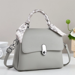 Off-white pebble leather crossbody bag with silk scarf handle and silver twist lock