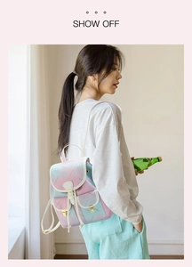 Detail of gradient purple mini backpack with floral print and gold hardware buckles