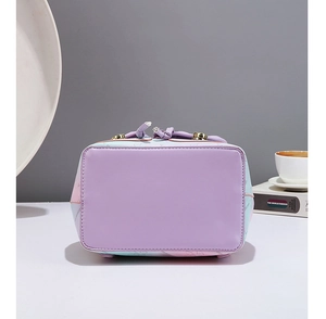 Detailed view of the purple gradient backpack base featuring protective gold metal feet