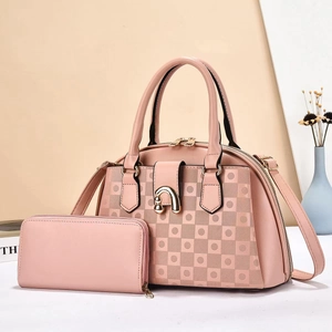 Detail of rose pink Boston handbag set with geometric texture and gold metal horseshoe buckle