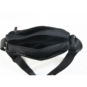 Minimalist black multi-compartment crossbody bag with wide letter-embossed strap