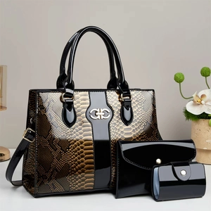 Three-piece black crocodile pattern tote bag set with elegant gold hardware and shoulder strap