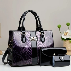 3-piece black patent leather handbag set with purple snake skin pattern and gold accents