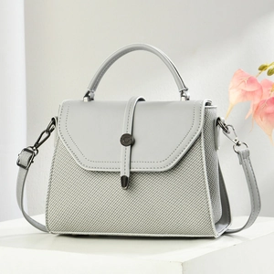Minimalist light gray square handbag with woven texture and round metal lock