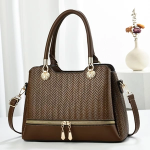 Minimalist deep brown tote bag with V-shaped woven texture and golden hardware details