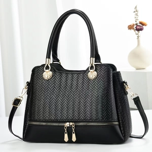 Elegant black leather tote bag with herringbone texture and gold-tone hardware details