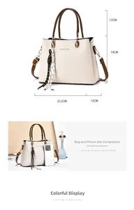 Detailed size comparison of a luxury cream handbag showing 25.5cm width and capacity