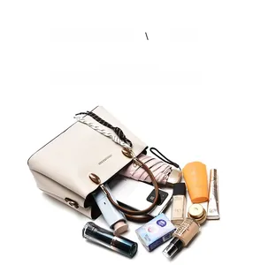 Top view of white pebble leather tote showing spacious capacity for daily essentials