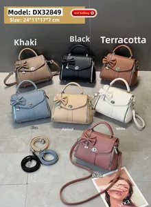 Detailed overhead view of multiple vintage leather crossbody bags in seven various colors