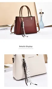 Detailed close-up of pebbled leather texture and metal S-buckle on crossbody bags