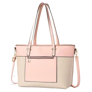 Pink leather and beige woven straw tote bag with long shoulder strap on white background