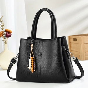 Minimalist black lychee pattern leather handbag for women with beaded tassel charm