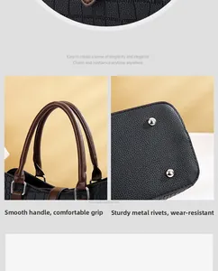 Détail du sac à main en cuir gaufré crocodile avec poignées brunes et rivets argentés