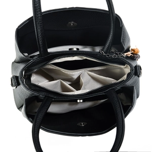 Interior view of black pebbled leather tote featuring three large storage compartments