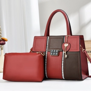 Deep red and chocolate brown two-piece tote bag set with grid strap and gold key charm