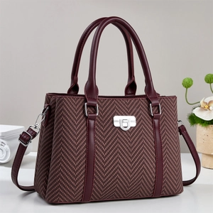 Fashionable chestnut tweed handbag with leather trim and adjustable crossbody strap
