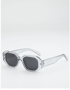 Vue détaillée de lunettes de soleil hexagonales gris translucide avec rivets argent