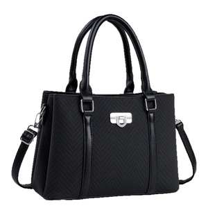 Classic black tote bag with herringbone texture, leather trim and silver buckle
