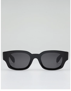 Détail de la finition brillante des montures de lunettes de soleil rétro en acétate noir épais