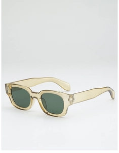 Détail de lunettes de soleil en acétate jaune translucide avec verres vert foncé et charnières
