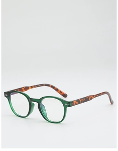 Détail de lunettes de soleil ovales vertes rétro avec branches élégantes en écaille