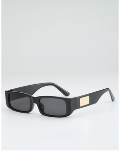 Detailed close-up of retro square sunglasses featuring a golden embossed metal temple piece