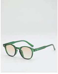 Détail de lunettes de soleil ovales vintage avec monture verte et verres dégradés marron