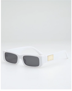 Macro detail of rectangle sunglasses featuring white frames and textured gold metal accents