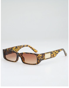 Detail of tortoise shell rectangular sunglasses with brown gradient lenses and gold metal accents