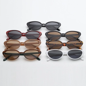 Detailed flat lay of trendy cat eye sunglasses in multiple vibrant colors and finishes