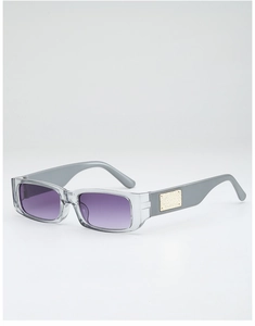 Detail of transparent gray square sunglasses featuring purple gradient lenses and gold metal trim
