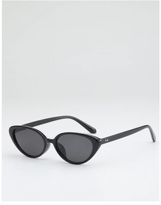 Detailed view of cat eye sunglasses with black frame, gray lenses and metal rivet accents