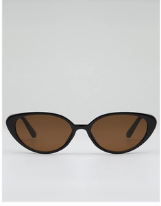 Detail view of vintage cat-eye sunglasses with metal hinges and black resin frame
