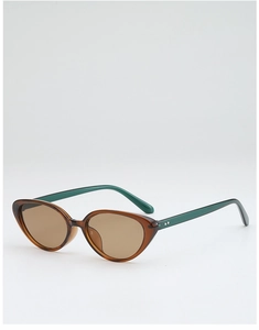 Detail of amber cat-eye sunglasses with tea lenses and contrasting dark green temples